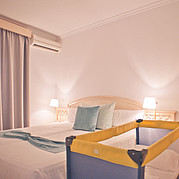 Family apartment, bedroom with cot Family apartment, bedroom with cot