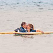 Spend time as a couple while child is cared for at the beach