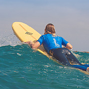 while paddling out overcome the waves
